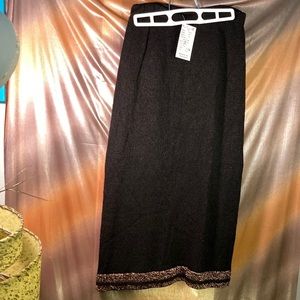 Vintage 1980’s black knit long skirt with bronze edging. 26” waist. 201